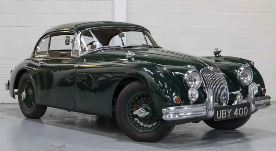 1959 Jaguar XK150 | Temecula Auto Repair & Transmission A green 1959 Jaguar XK150 on display.