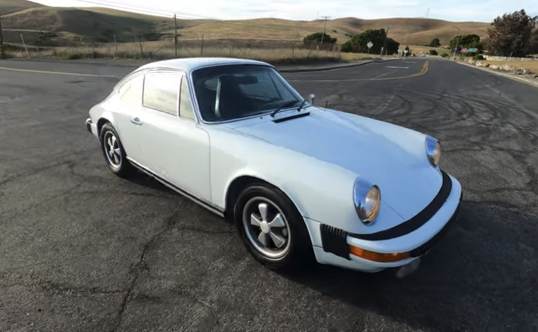 Air-cooled Porsche 911 | Temecula Auto Repair & Transmission A white Air-cooled Porsche 911 on an empty road.