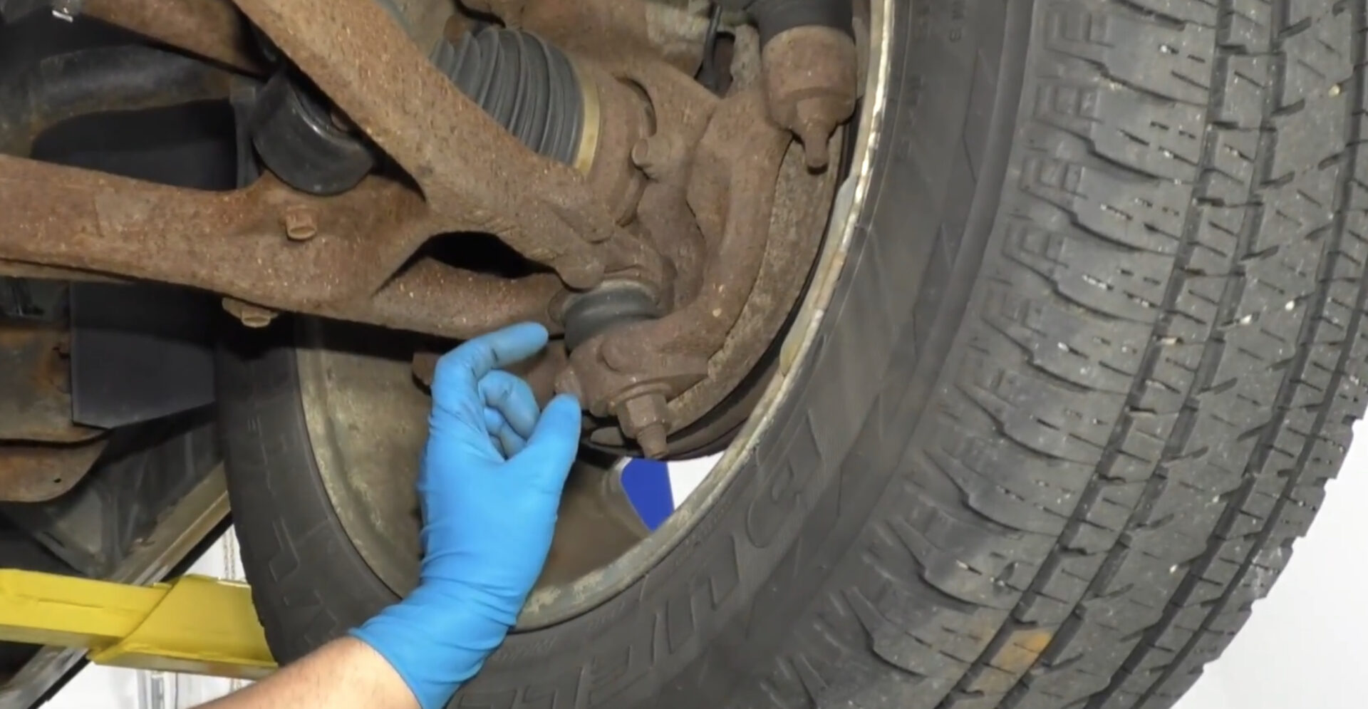 Excessive play in a Ball Joint requiring replacement.