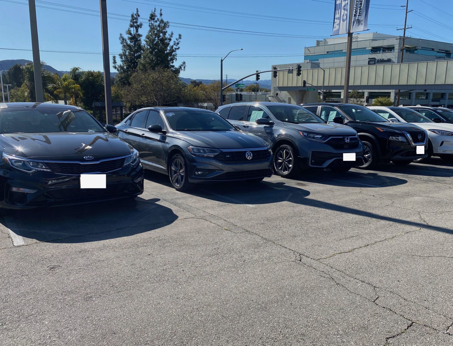 Best Used Cars For Teens & College Students | Temecula Auto Repair & Transmission LIne-up of used cars for sale on a car lot.