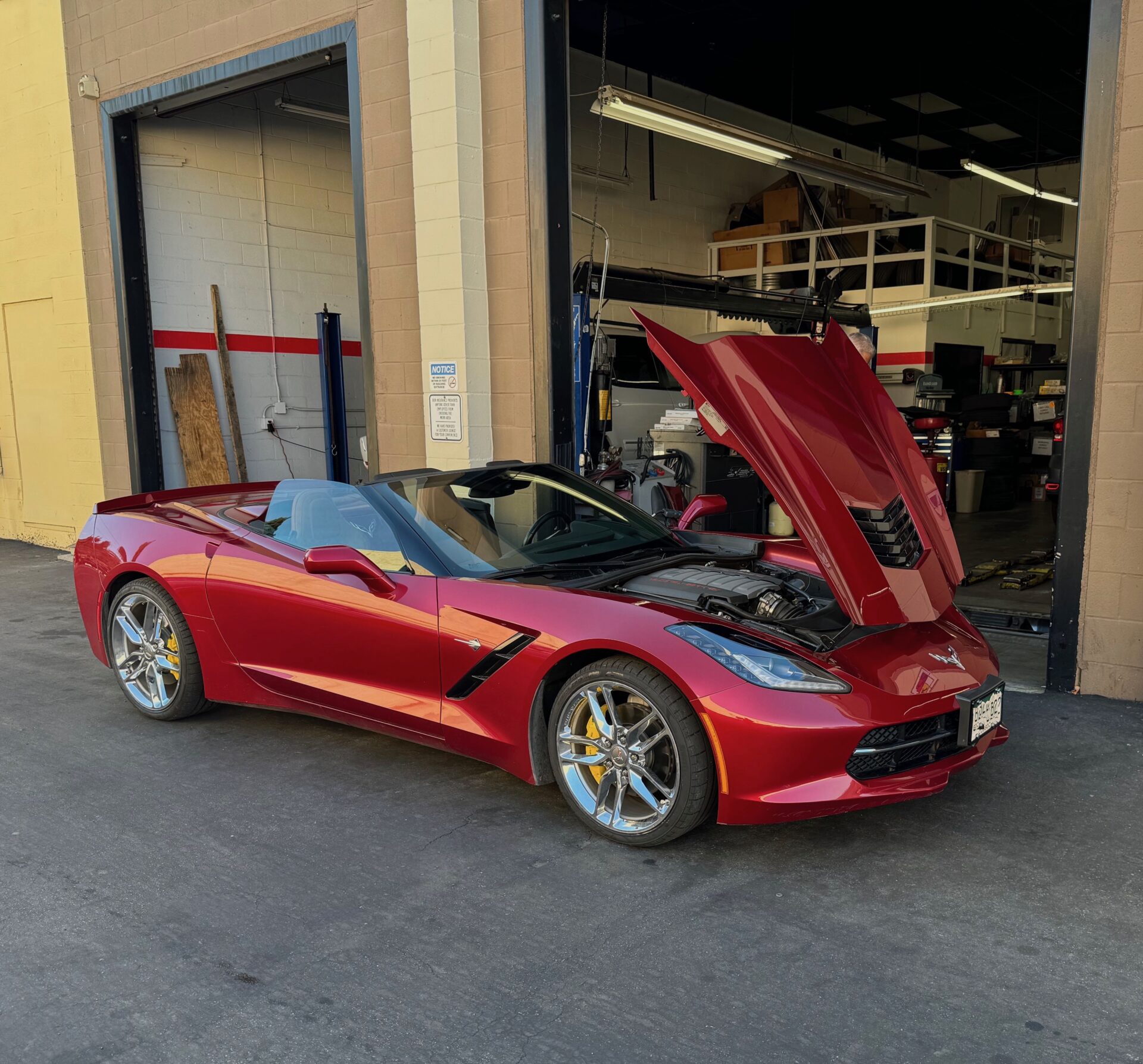 C7 Corvette | Temecula Auto Repair & Transmission Burgundy C7 Corvette with hood opened at Temecula Auto Repair & Transmission.