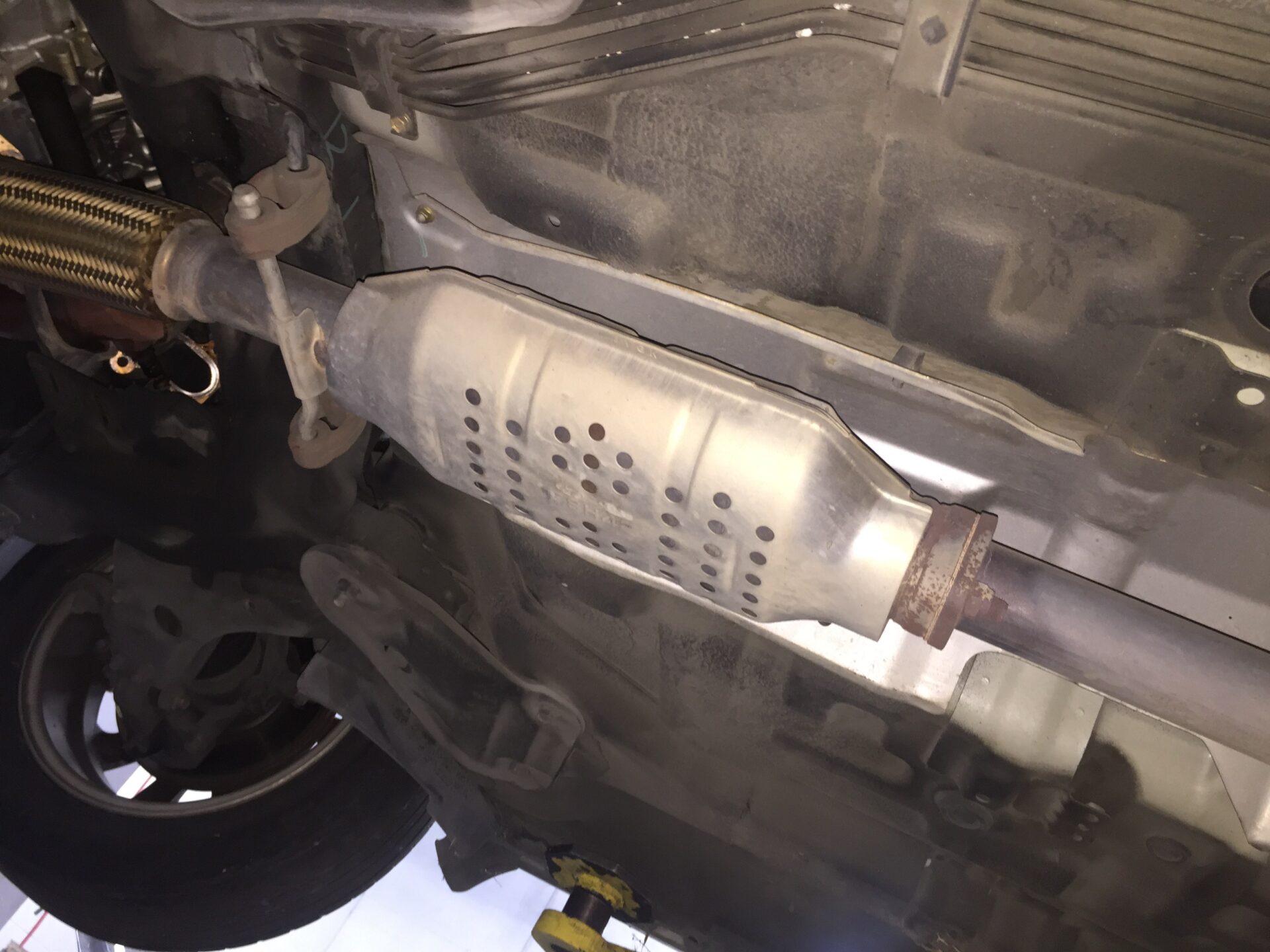 CatConverter | Temecula Auto Repair & Transmission Undercarriage view of a catalytic converter.
