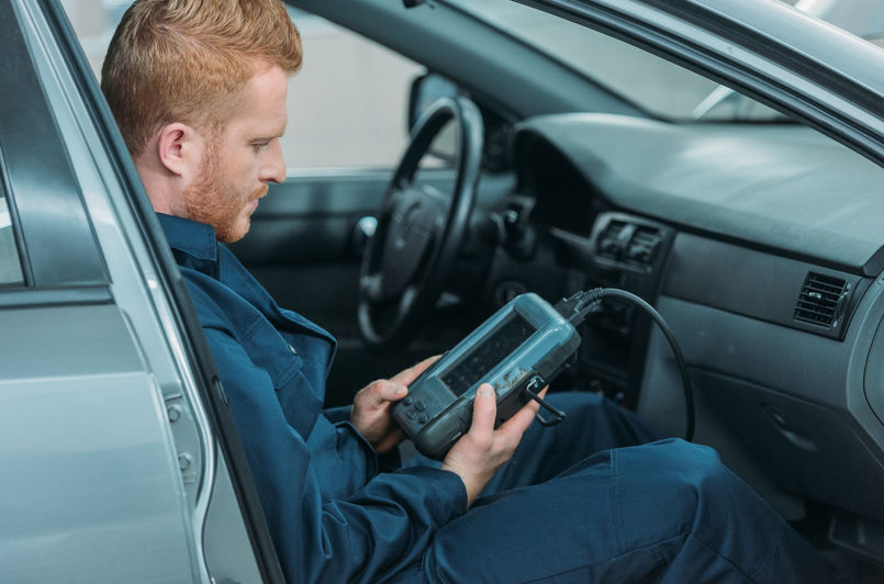 Technician scanning for codes related to Check Engine Light