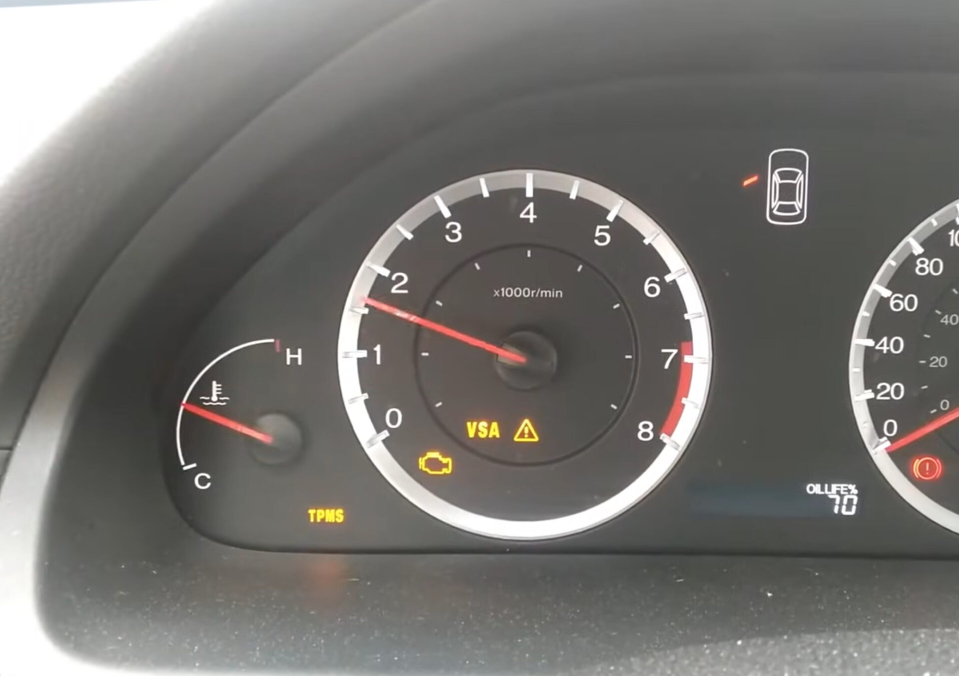 Vehicle's instrumentation with the Check Engine Light illuminated.