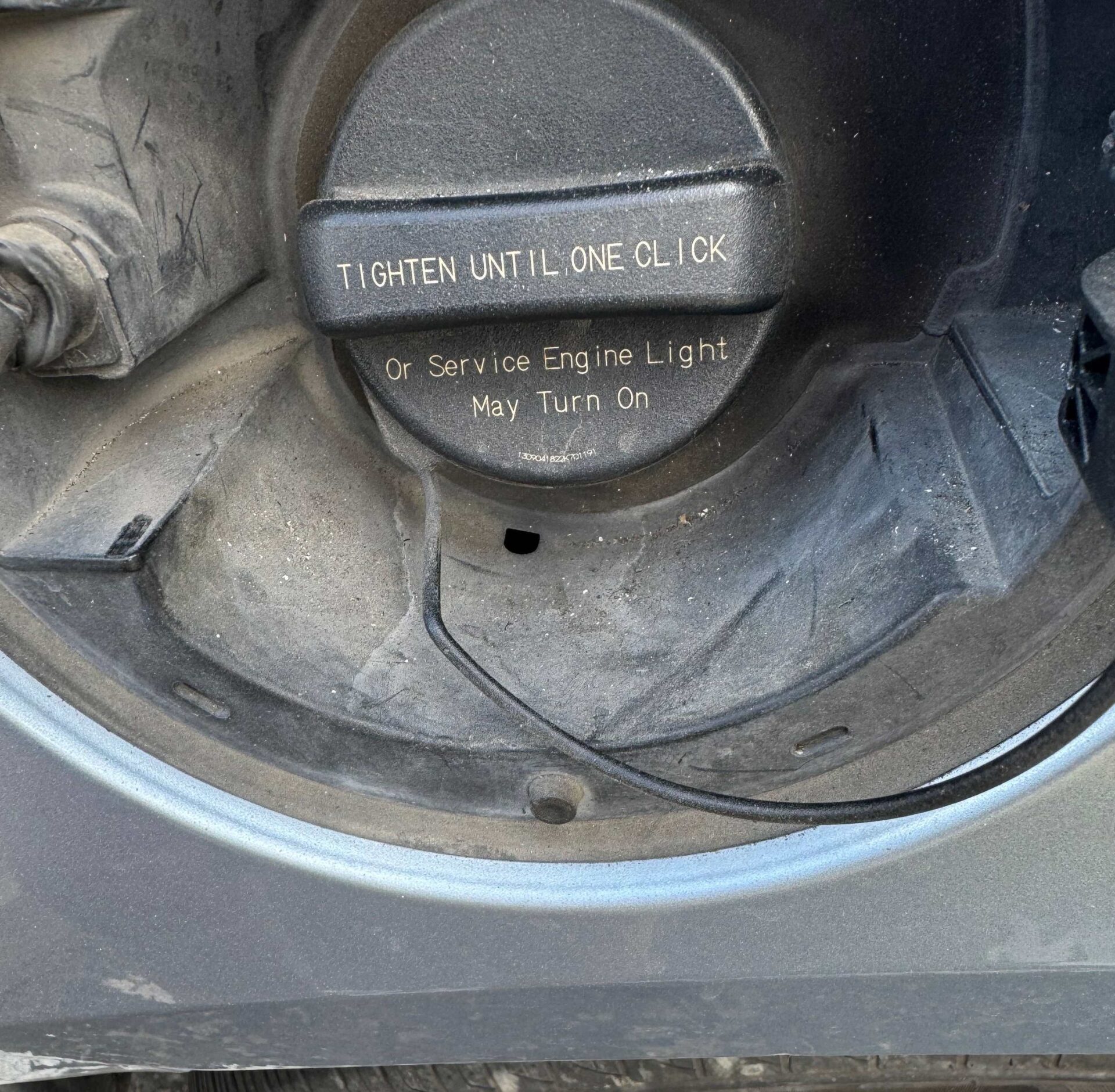 Fuel Cap | Temecula Auto Repair & Transmission Gas cap with an imprinted warning to tighten it until it clicks to avoid a Check Engine Light.