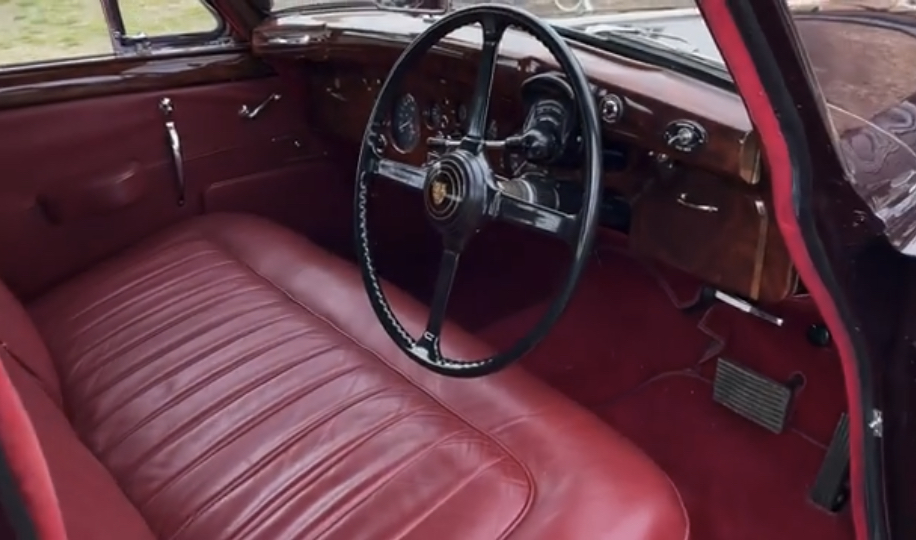 Jaguar Mark IX Interior | Temecula Auto Repair & Transmission The door is open on a right-hand-drive Jaguar Mark IX, showing the luxurious interior.