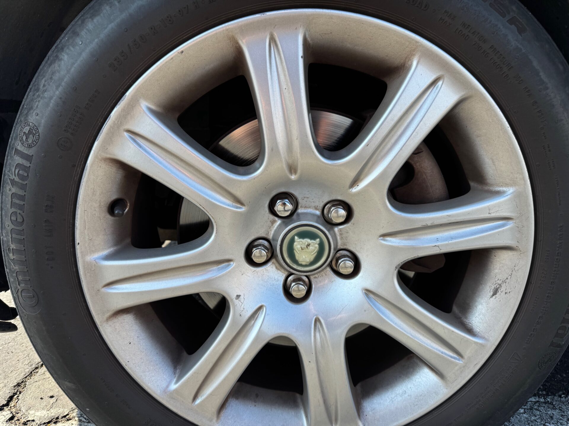 Jaguar XJ6 Front Disc Brakes | Temecula Auto Repair & Transmission Jaguar XJ6 Front Disc Brakes as seen through the wheel slots.