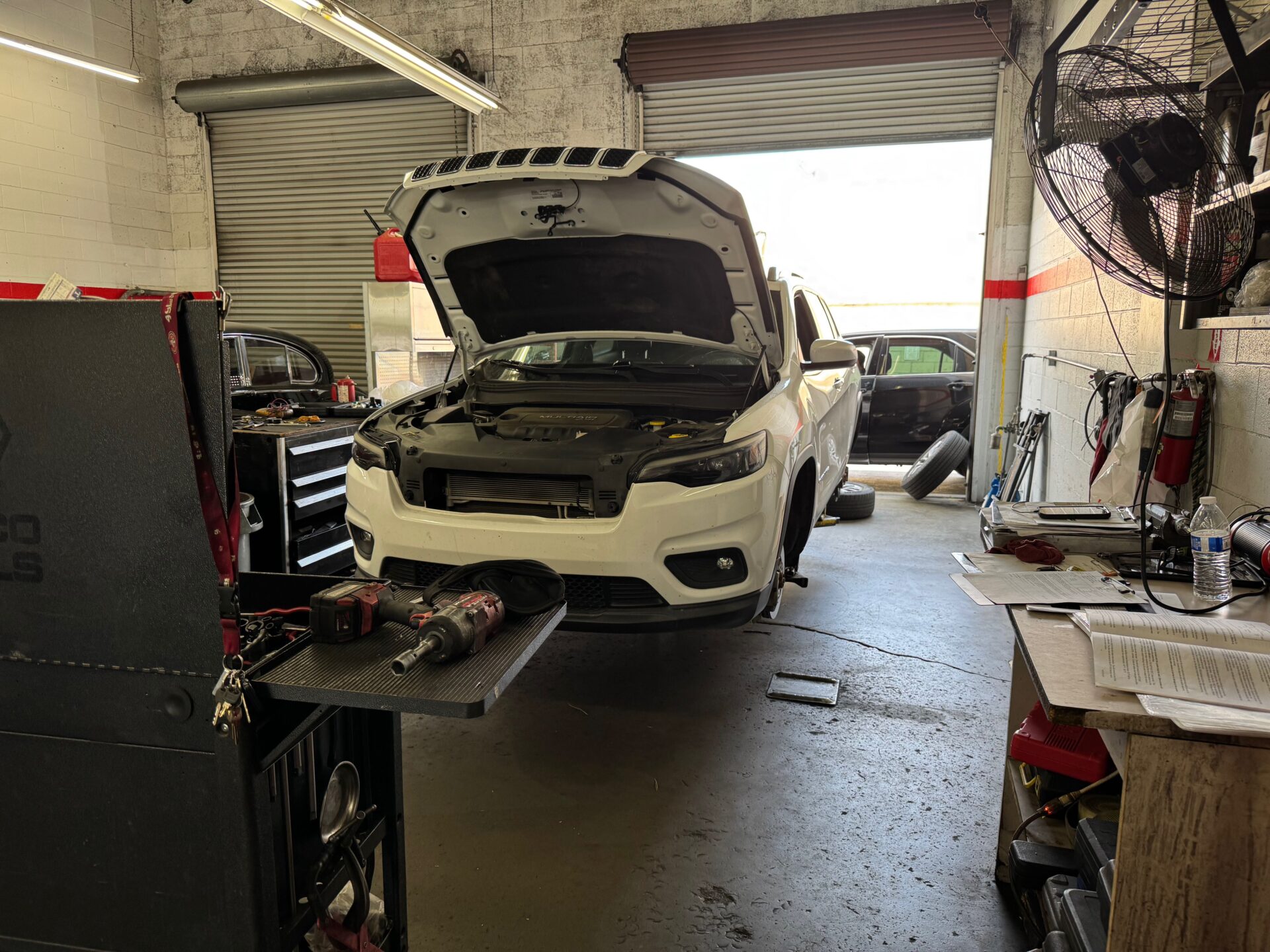 Jeep Cherokee Repair in Temecula and Murrieta | Temecula Auto Repair & Transmission Jeep Cherokee on lift for service at Temecula Auto Repair & Transmission