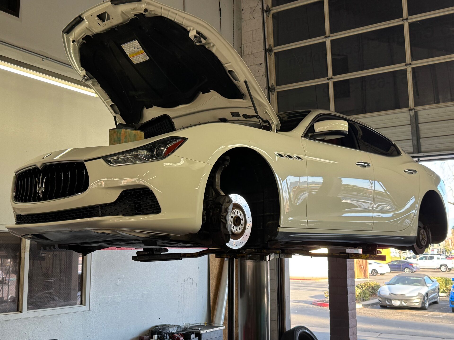 Maserati Brake job at Temecula Auto Repair | Temecula Auto Repair & Transmission A Maserati Ghibli with its wheels off for a Brake Job