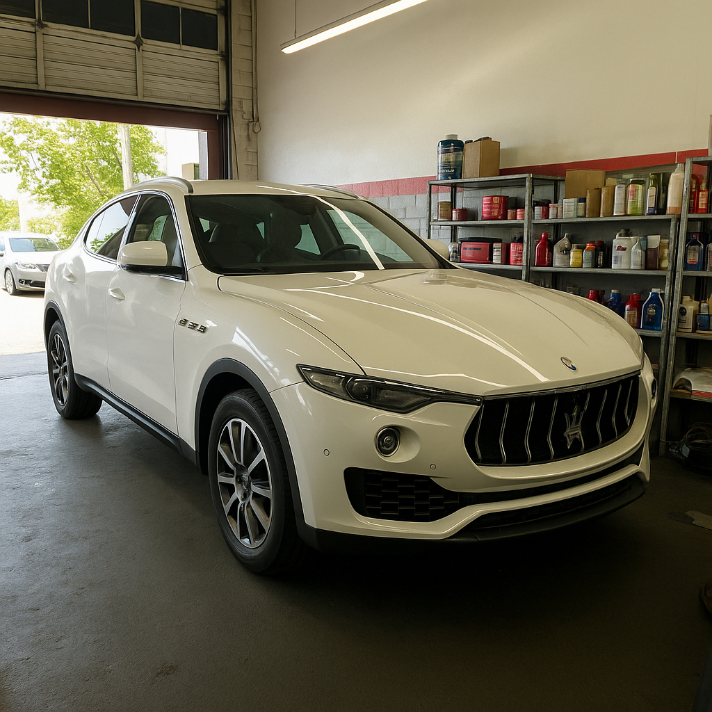 Maserati Levante Service Repair | Temecula Auto Repair & Transmission A white Maserati Levante in the service bay at Temecula Auto Repair & Transmission
