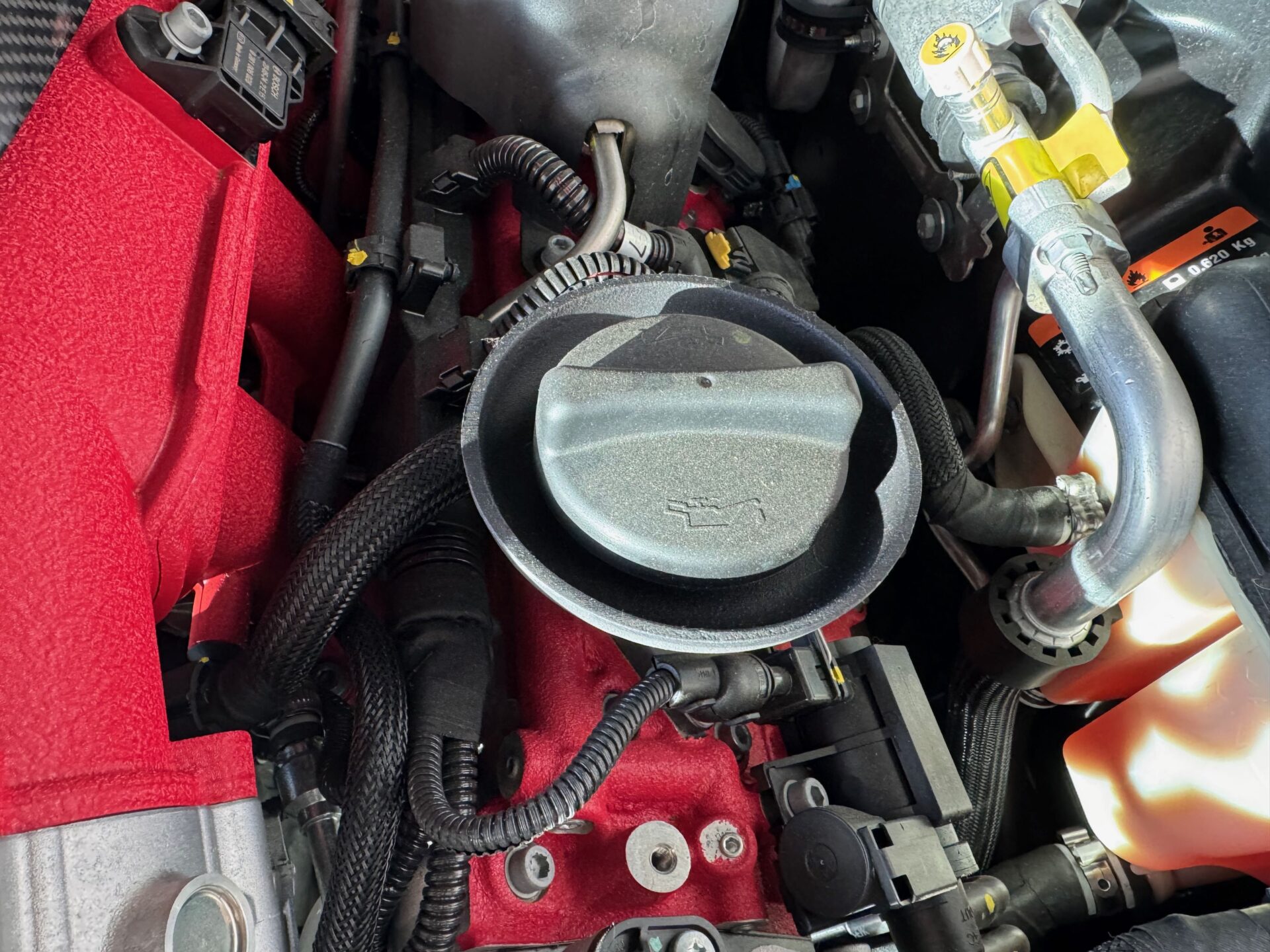 Maserati Oil Fill Cap_Temecula Auto Repair Transmission | Temecula Auto Repair & Transmission The hood is open on a Maserati, showing the Oil Fill Cap at Temecula Auto Repair Transmission
