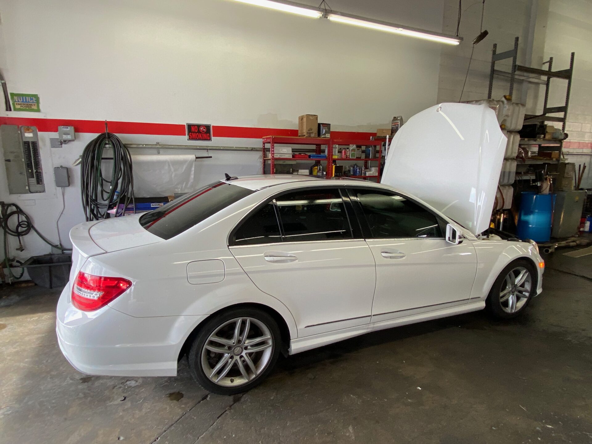 Mercedes Benz C250 Service Repair in Temecula Murrieta | Temecula Auto Repair & Transmission A Merceds-Benz C-250 in the service bay with its hood open for service.