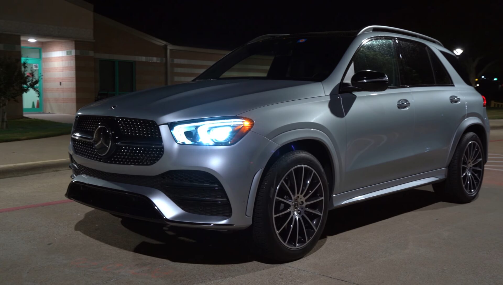 Mercedes-Benz GLE SUV | Temecula Auto Repair & Transmission A Mercedes-Benz GLE SUV pictured in a parking lot at night with its light on.