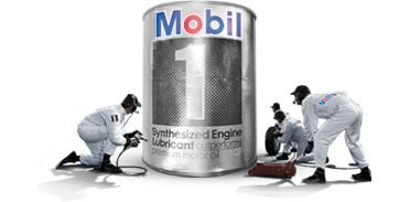 Mobil1 Synthetic Motor Oil | Temecula Auto Repair & Transmission A pit crew with a giant can of Mobil1 Synthetic Motor Oil