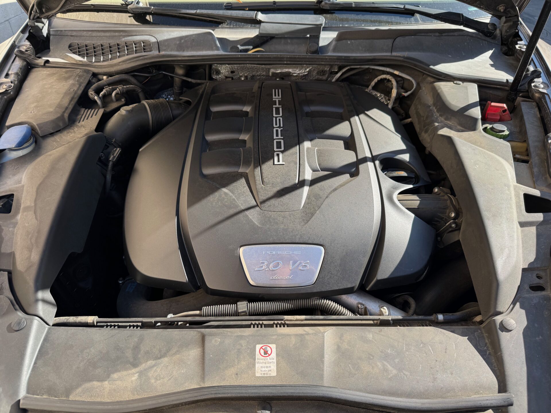 Porsche 30 V6 Diesel Engine | Temecula Auto Repair & Transmission The hood is open on a Porsche Cayenne with the Porsche 30 V6 Diesel Engine in view.