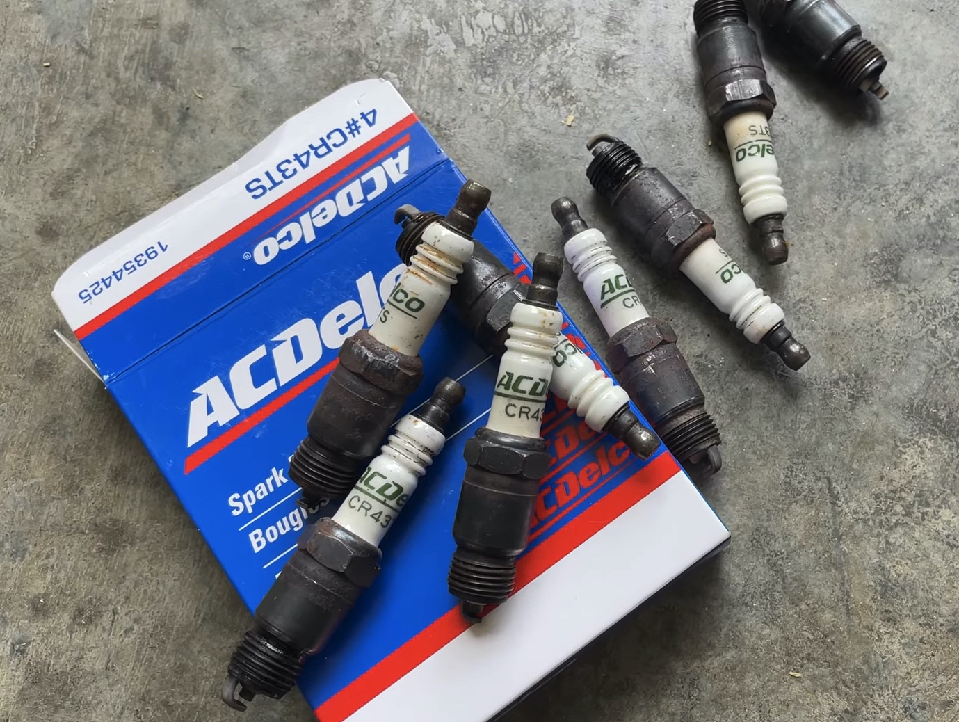 Spark Plugs - Old | Temecula Auto Repair & Transmission Old fouled spark plugs that were removed from a General Motors car.