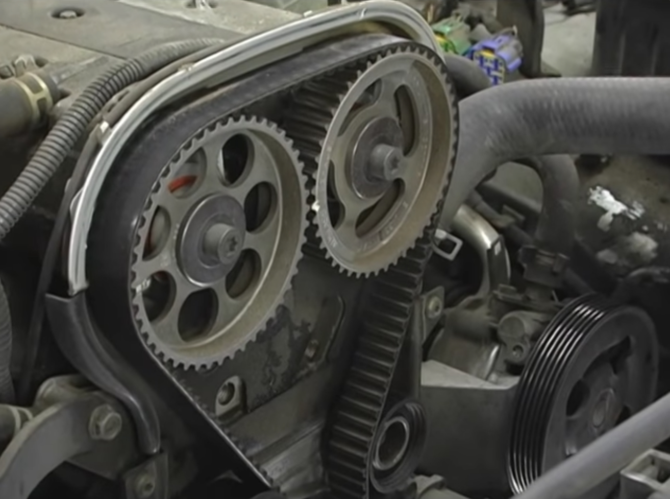 Timing-Belt | Temecula Auto Repair & Transmission A timing cover removed, revealing the Timing-Belt