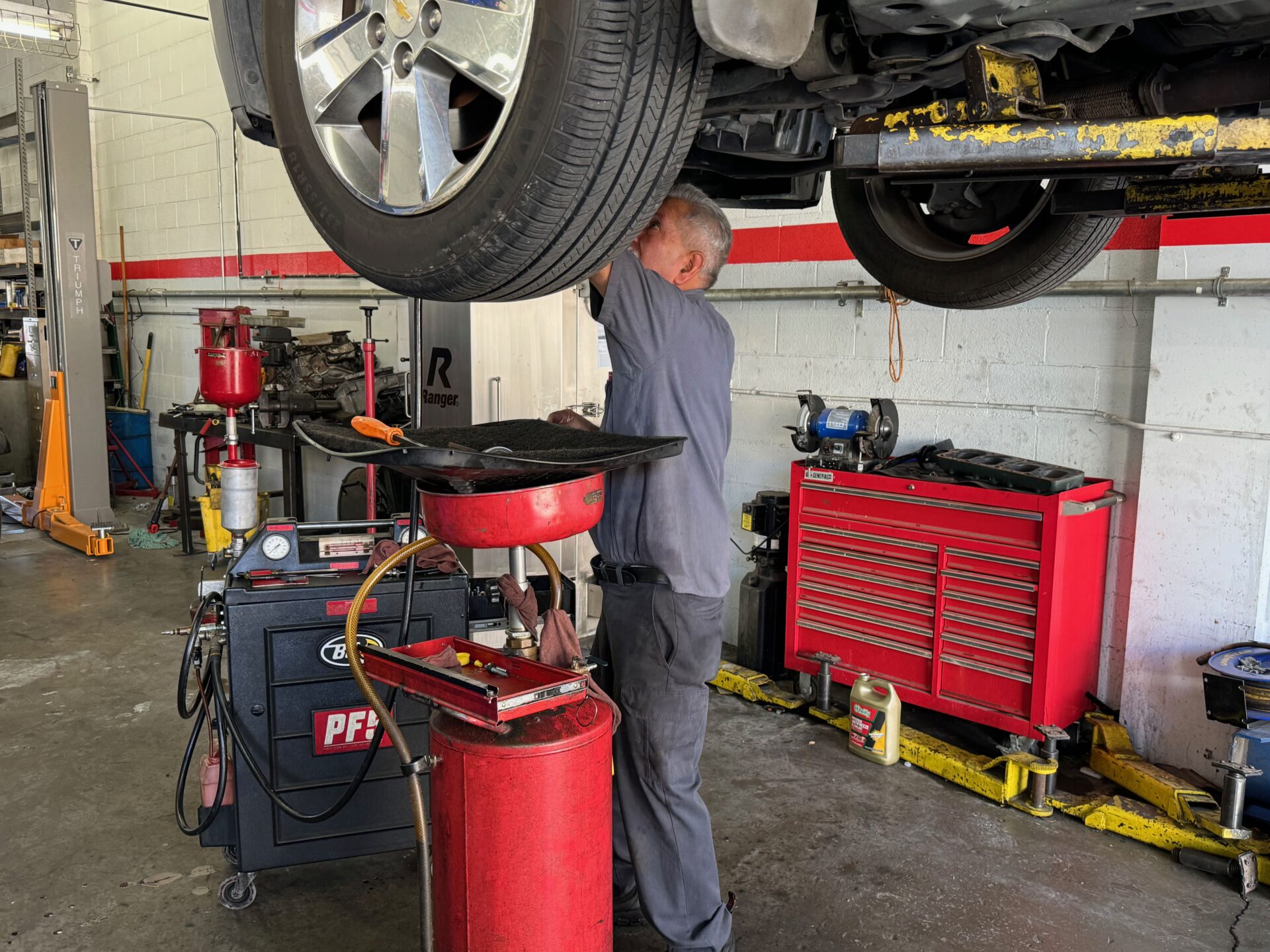 Transmission Fluid Exchange at Temecula Auto Repair | Temecula Auto Repair & Transmission Our Technician examines a transmission at Temecula Auto Repair & Transmission.