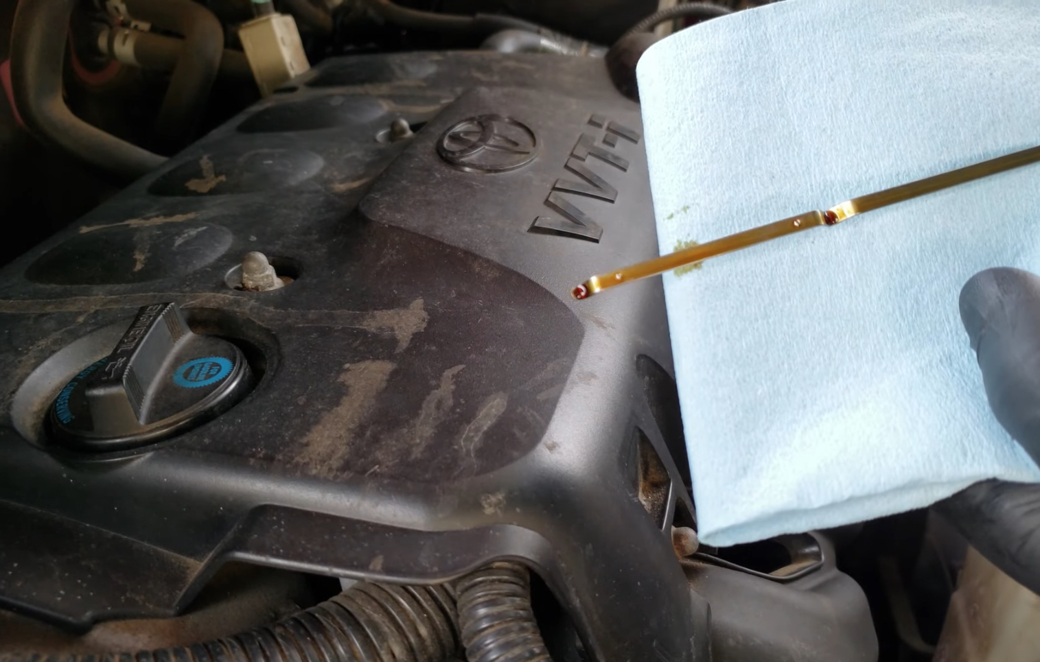 Used Car Inspection Checking Engine Oil | Temecula Auto Repair & Transmission Checking the oil dipstick on a used car that's for sale
