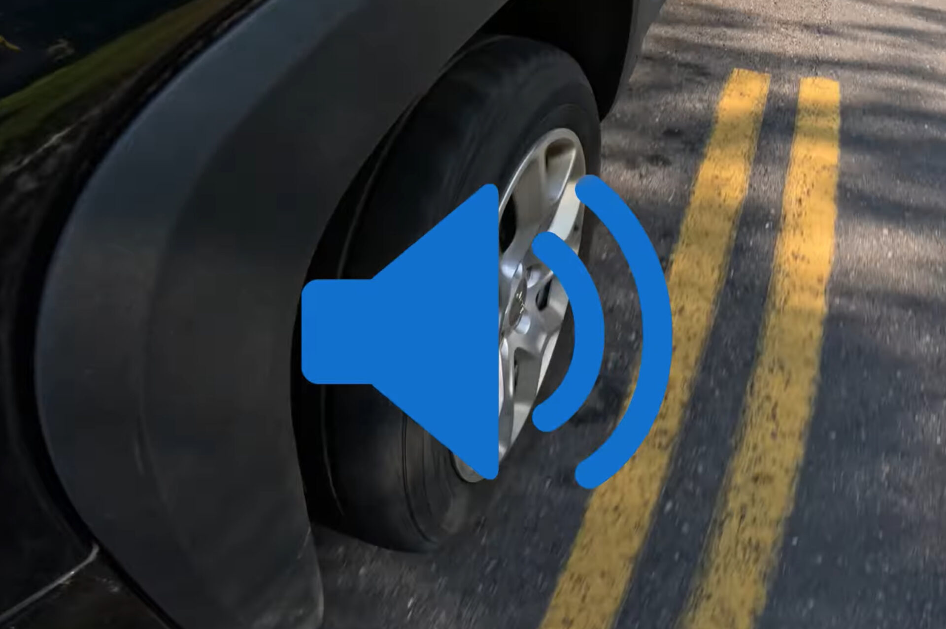 A car going down the road with a noisy wheel bearing.